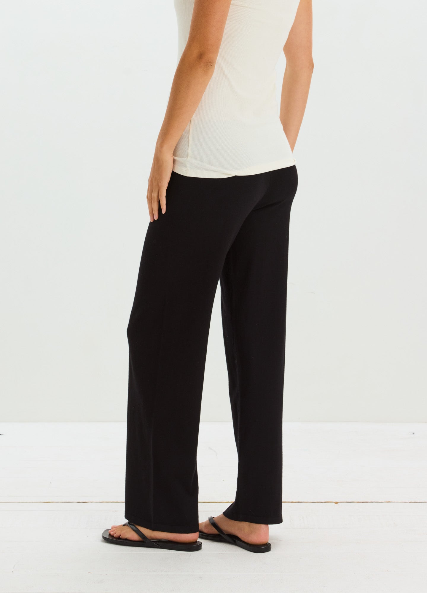 Black wide-leg maternity pants with a high, stretchy waistband designed for comfort during pregnancy.
