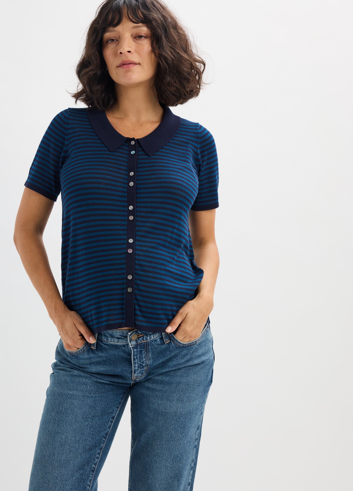 Navy blue and black striped short-sleeve maternity shirt with front buttons and round neckline.