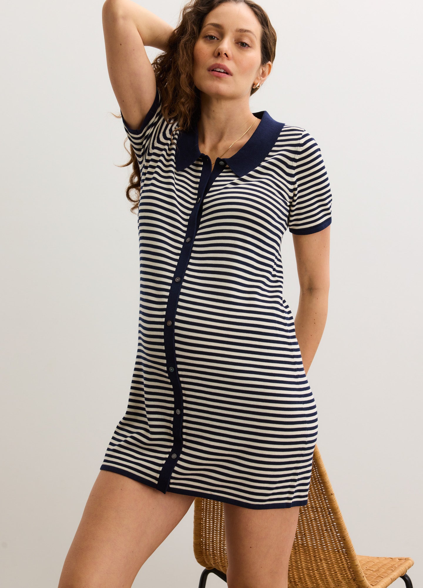 Navy and white striped short-sleeve maternity dress with a navy collar and button-down front, designed for pregnant women.