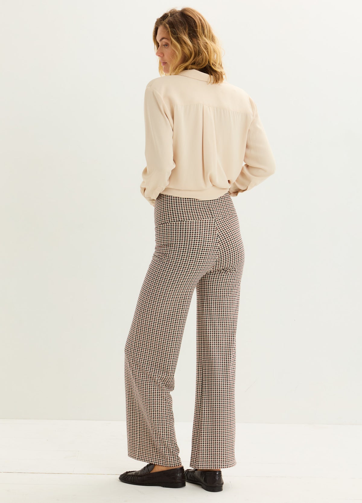 Beige ribbed maternity pants with wide legs, designed for pregnant comfort and support.