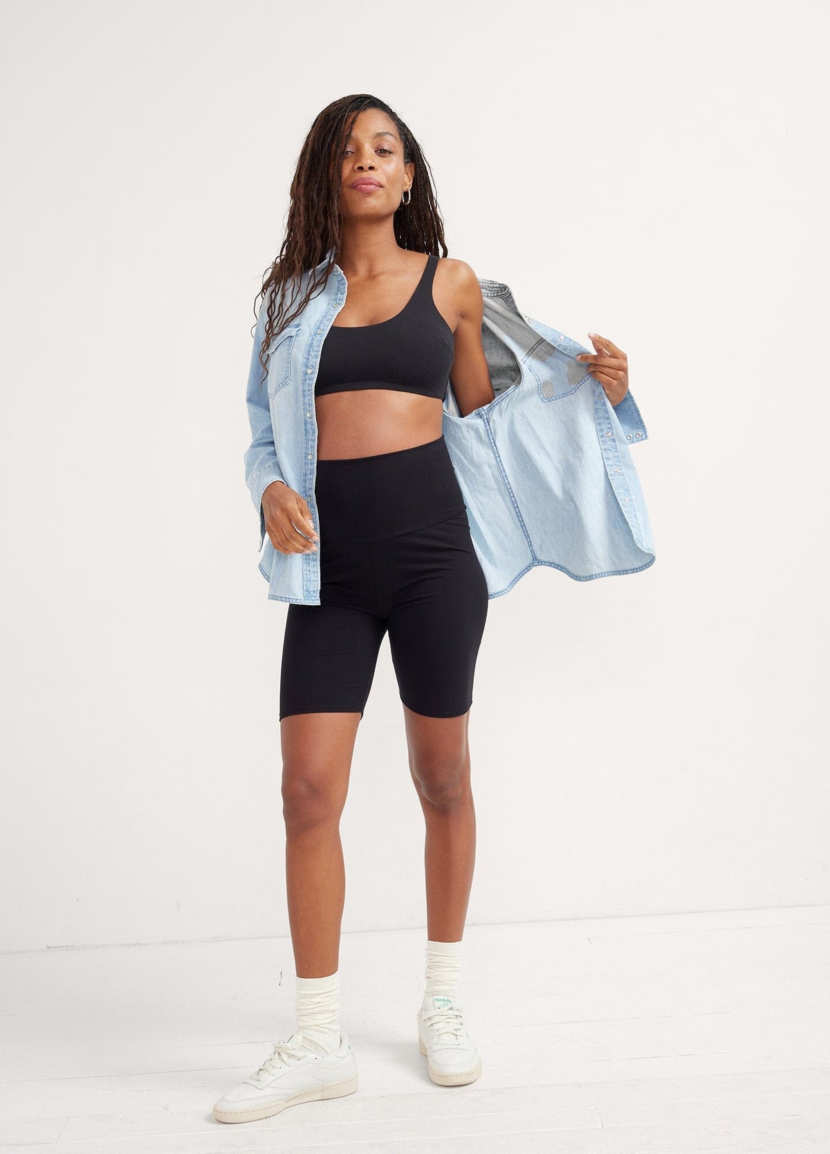 The Ultimate Before, During & After Bike Short - Black high-waisted maternity bike shorts with supportive panel, styled for pregnancy, nursing, and postpartum comfort.
