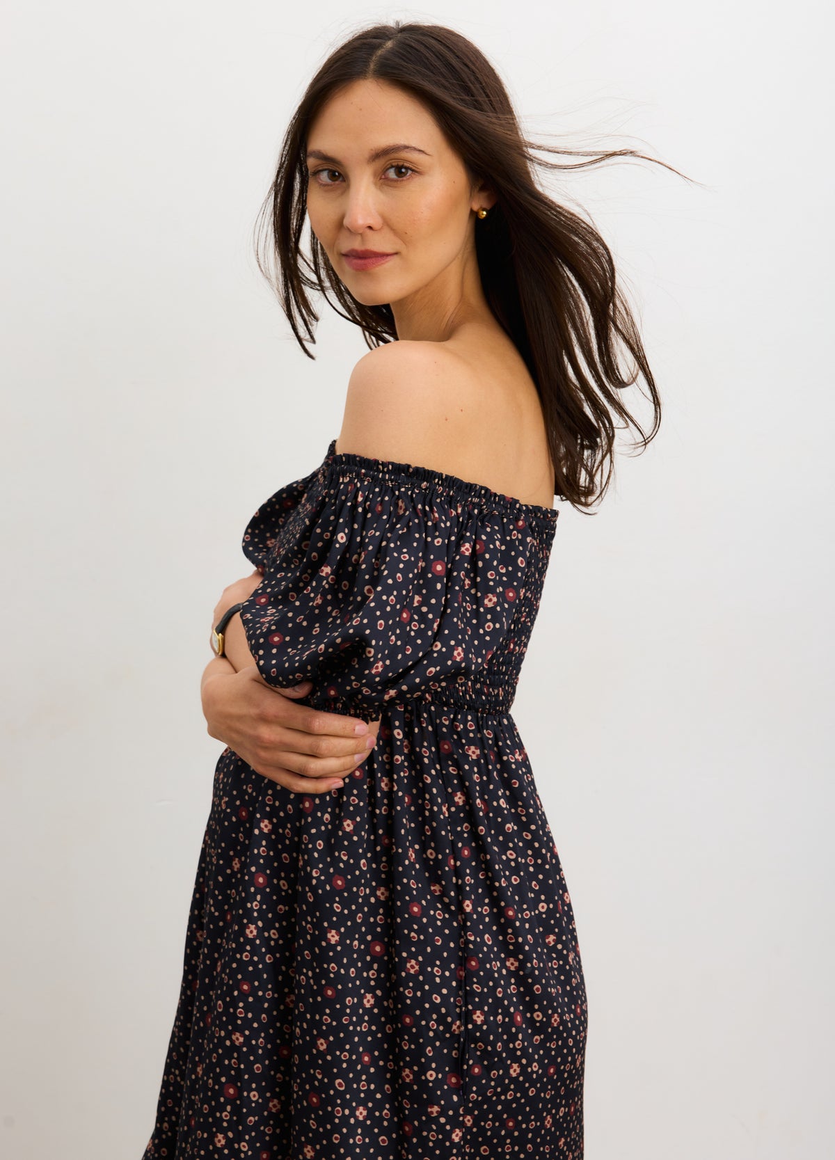 Navy multi maternity dress with off-shoulder neckline and elastic waist, designed for pregnant women.
