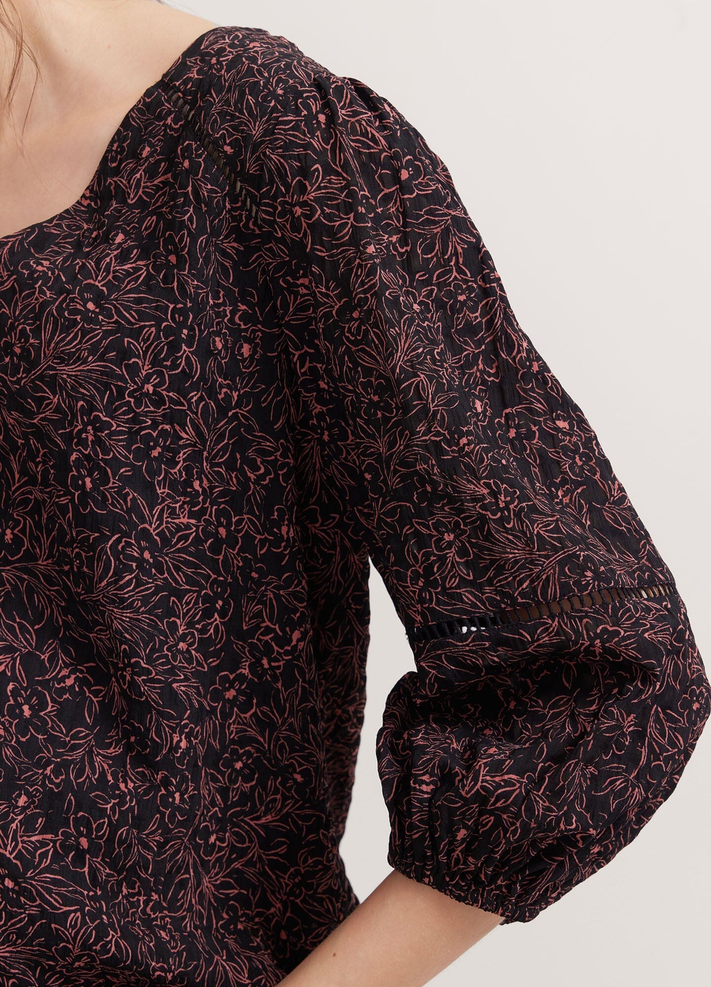 The Juliet Top - Black and pink floral maternity nursing top with V-neck and 3/4 puff sleeves, ruched sides for postpartum comfort.