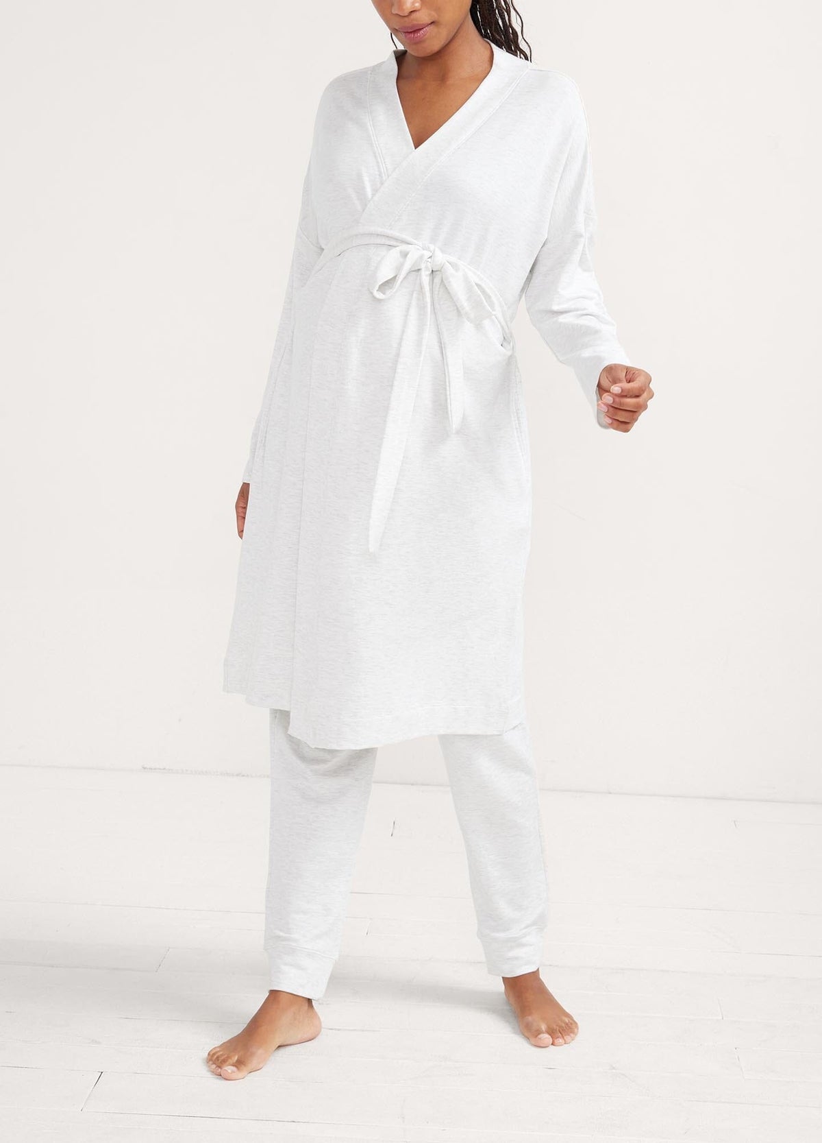 The Robe - Soft white maternity robe with waist tie, designed for pregnancy, nursing, and postpartum comfort.
