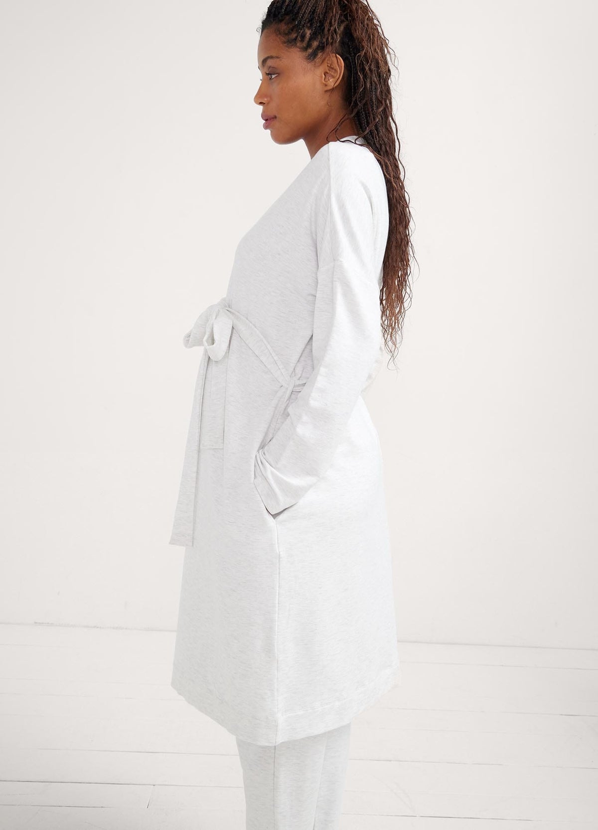 The Robe - Soft white maternity robe with waist tie, designed for pregnancy, nursing, and postpartum comfort.