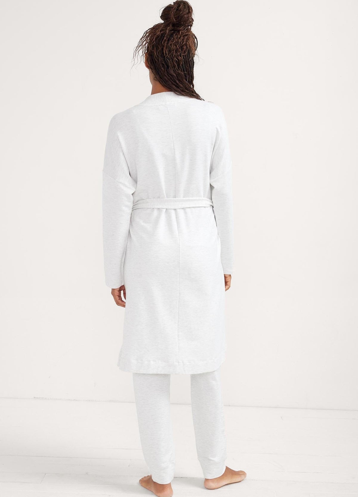 The Robe - Soft white maternity robe with waist tie, designed for pregnancy, nursing, and postpartum comfort.