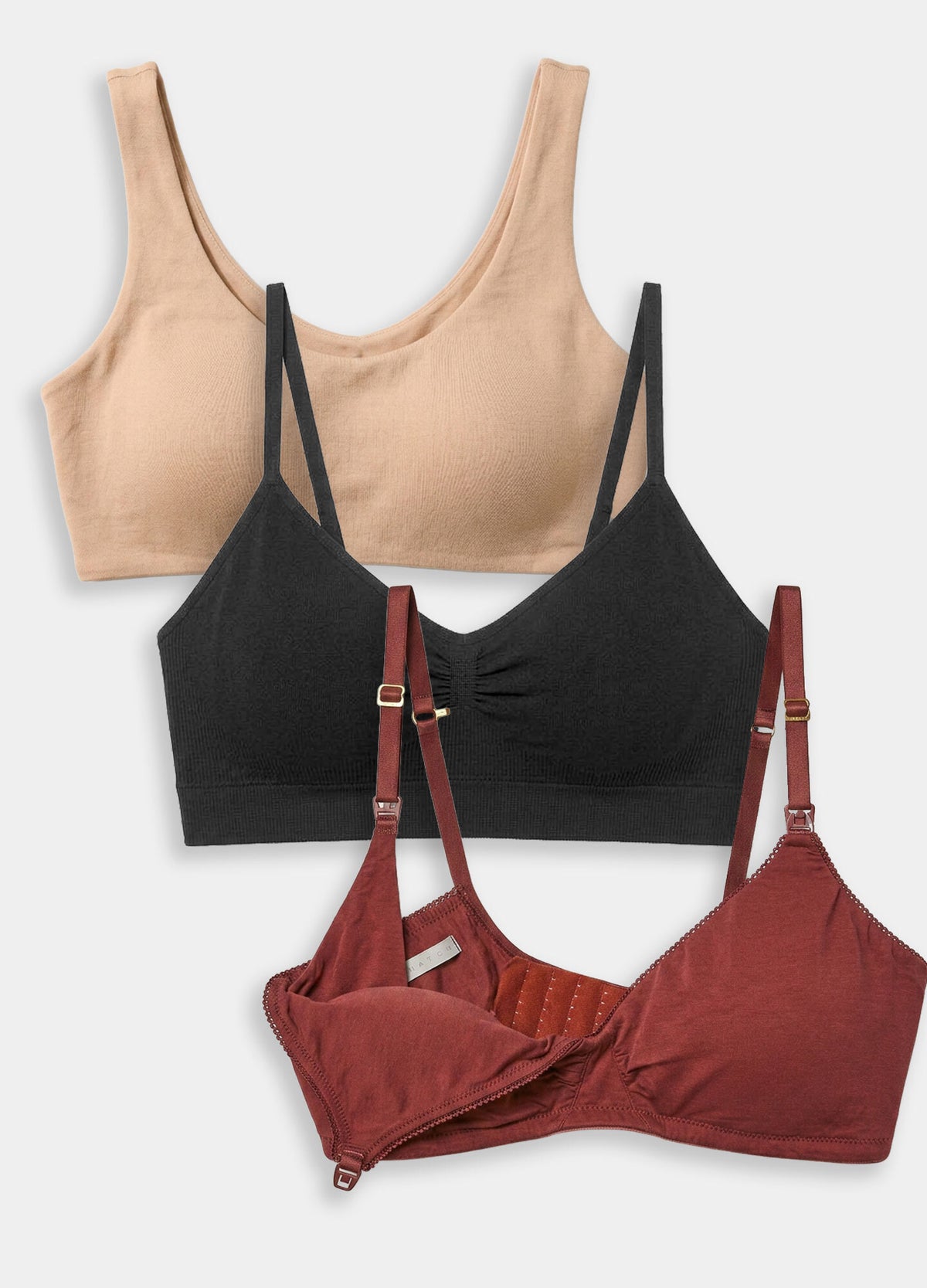 Set of three maternity bras in beige, black, and rust with soft fabric and adjustable straps.