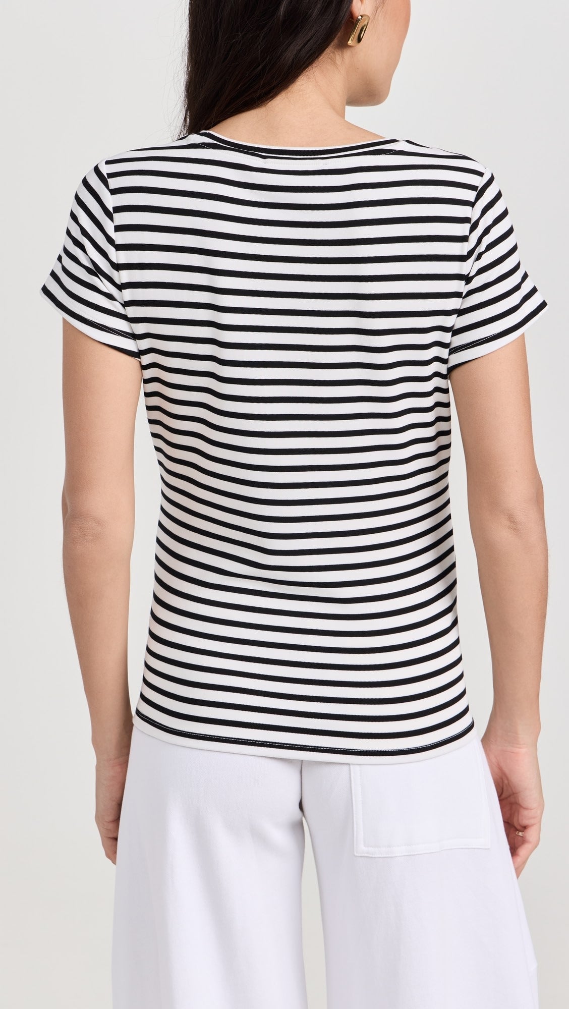 Black and white horizontal striped maternity crewneck shirt with short sleeves, fitted to a pregnant silhouette.