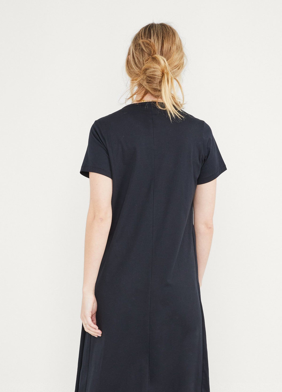 The Easy Going Nursing Tee Dress - Black maternity nursing tee dress with short sleeves, crew neck, and relaxed fit ideal for pregnancy and postpartum.