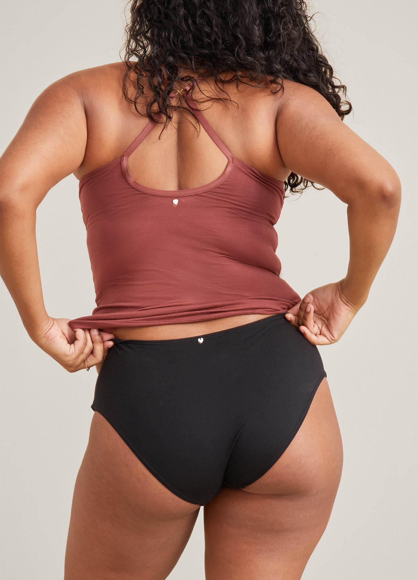 The 24/7 Nursing Tank POS - Buff-colored nursing tank with scoop neckline and slim straps, designed for maternity and postpartum wear.