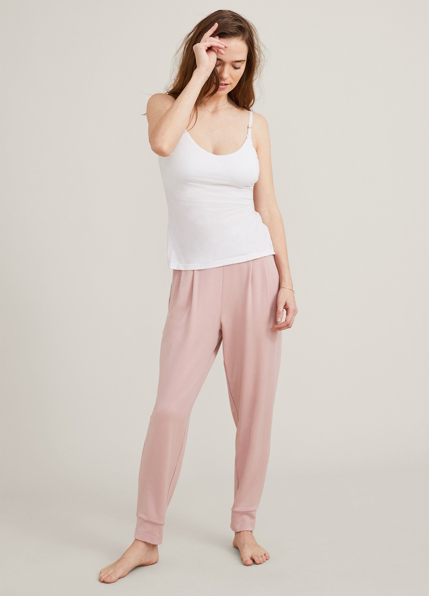 The 24/7 Nursing Tank POS - Buff-colored nursing tank with scoop neckline and slim straps, designed for maternity and postpartum wear.