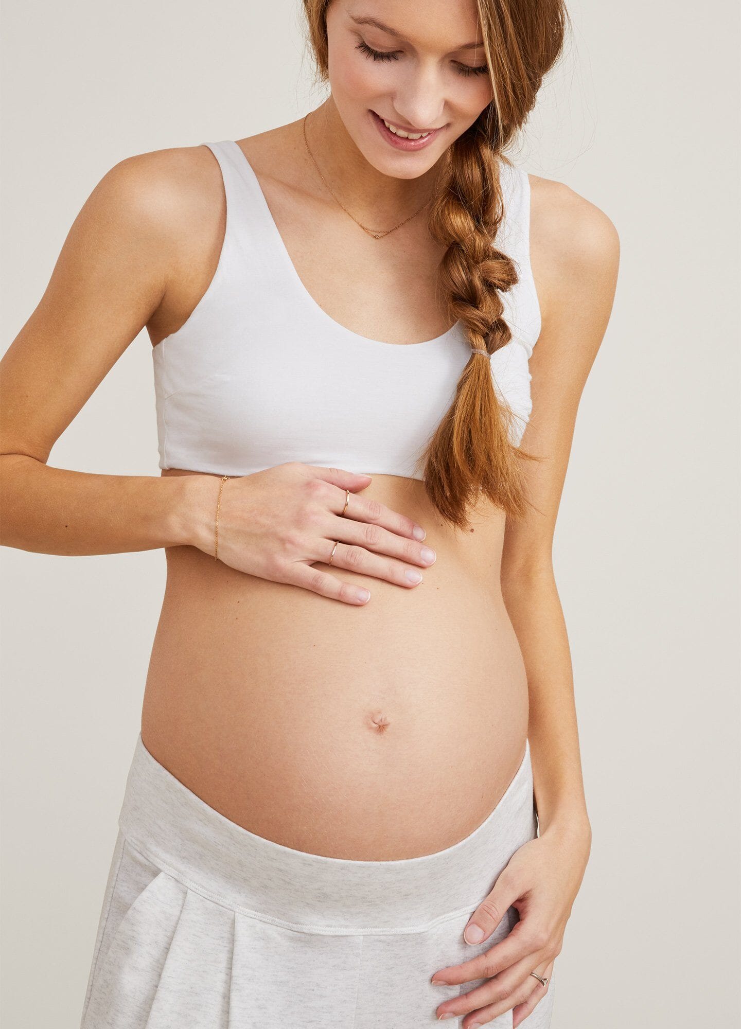 White maternity bra with wide straps and soft, seamless fabric designed for pregnant women.