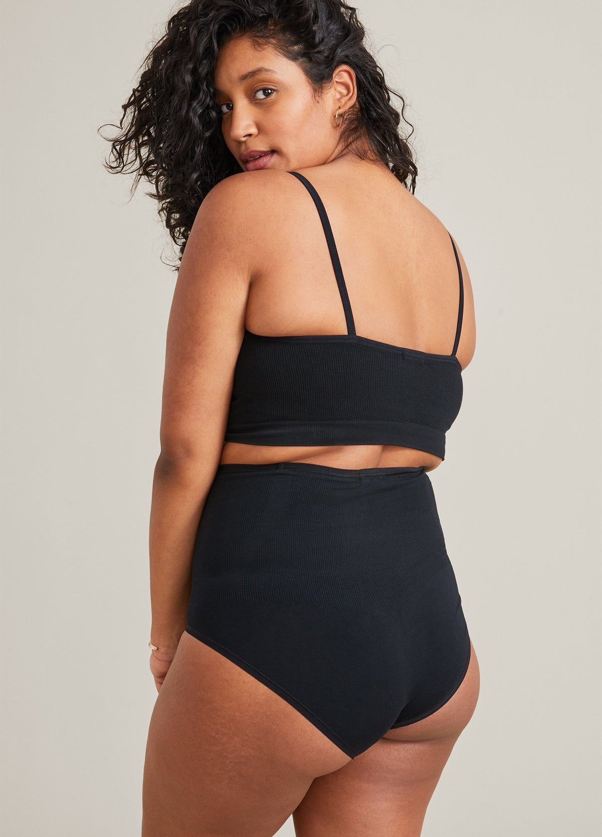 The Seamless Belly Brief - Black seamless high-waisted belly brief designed for maternity, pregnancy, nursing, and postpartum support.