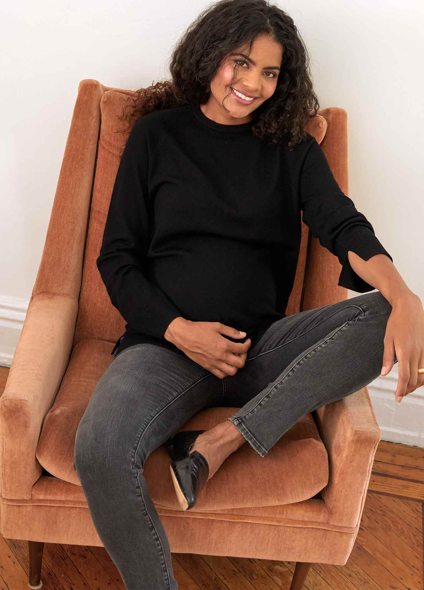 The Over The Bump Slim Maternity Jean - Slim black washed maternity jeans with over-the-bump fit, worn during pregnancy and postpartum.