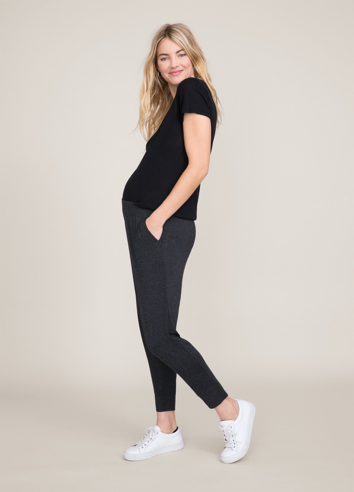 The Fitted Vee - Black fitted maternity tee with short sleeves and a V-neck, designed for pregnancy, nursing, and postpartum comfort.