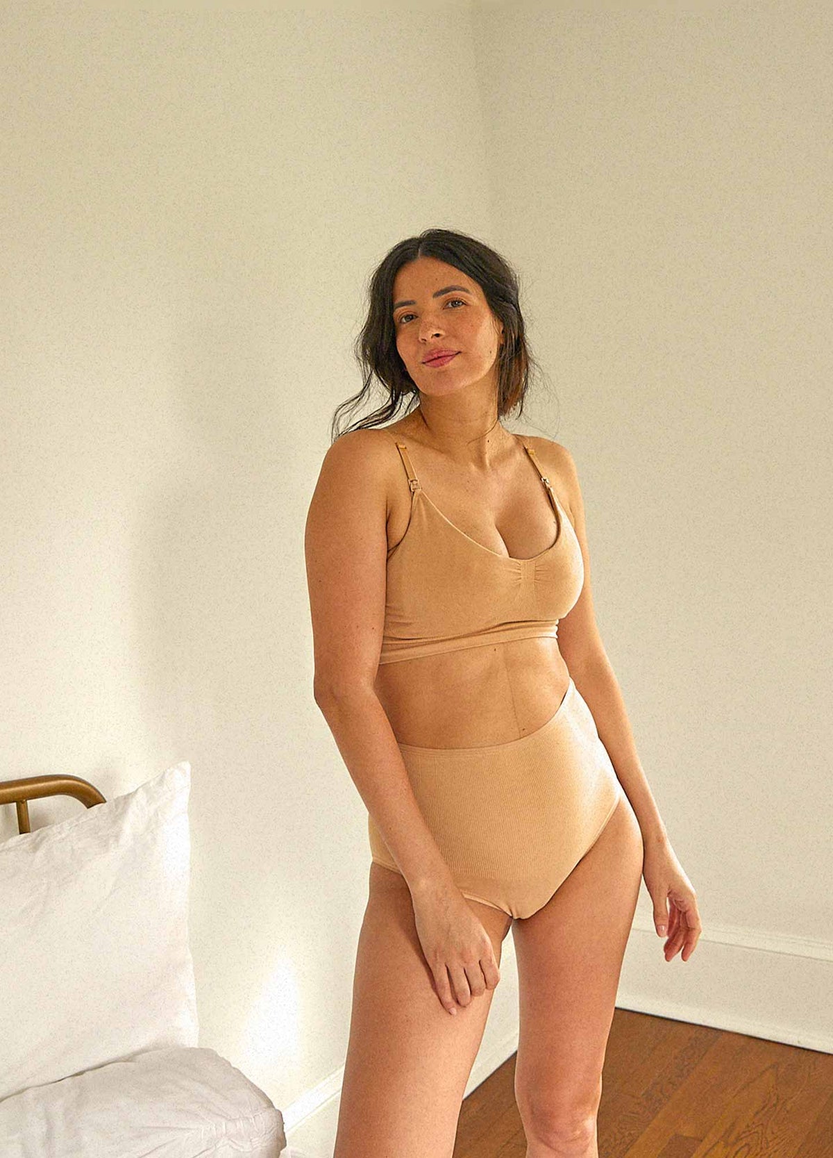 The Essential Nursing And Pumping Bra - Sand-colored maternity bra with adjustable straps designed for nursing and postpartum comfort.