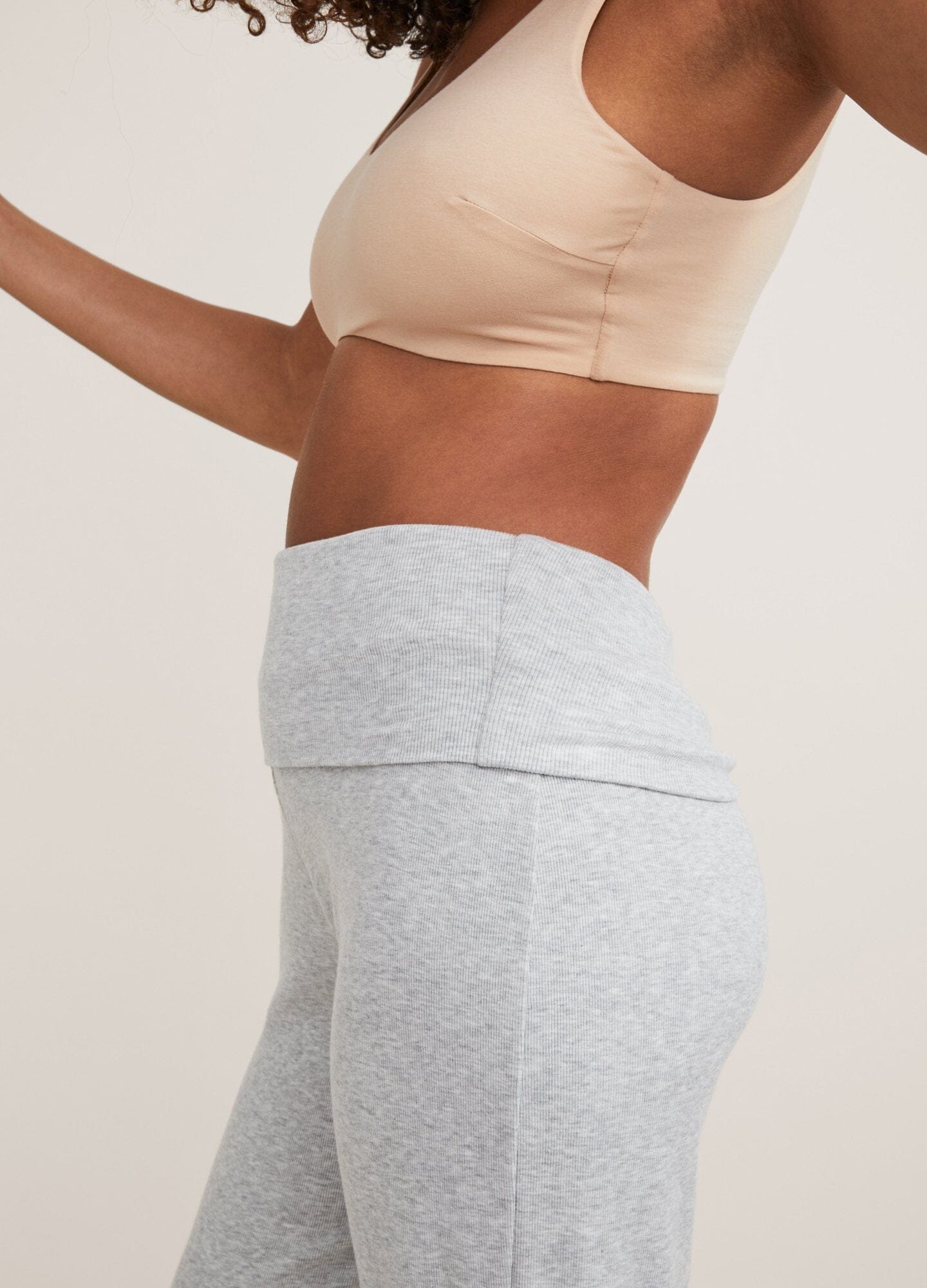 Nude seamless maternity bra with smooth cups and wide supportive straps.